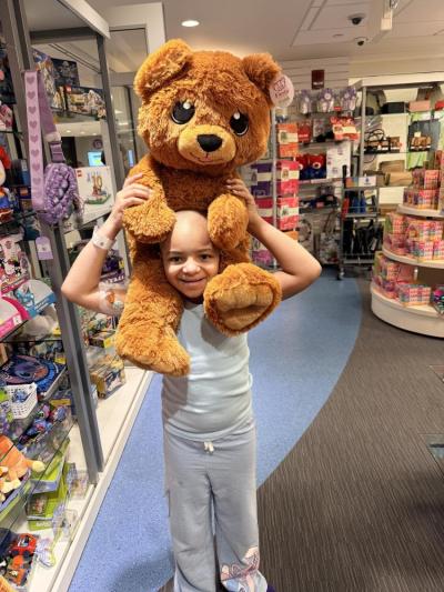 Mia purchases a gift for a friend who needed treatment at Boston’s Children’s Hospital. Photo source: Briana Lunetta