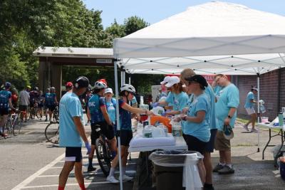 Volunteers served food and water for the tired cyclists. 