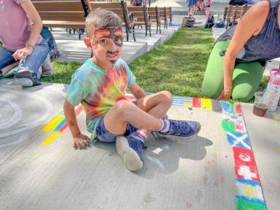 Tommy McGrath, 6, painted flags of all the countries in the World Cup, his favorite event of the summer. Photo by Christian Uva