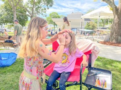Addilynn McIntyre, 6, gets her face painted. Photo by Christian Uva