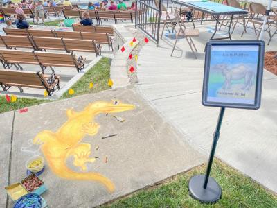 Lain Potter's gecko, Slim Shady, and her winning work from last year. Photo by Christian Uva