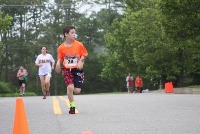 Noah Brilliant of Plymouth approaches the finish line in the 2017 Lazy Lobster Road Race. Photo by Matthew Bernat