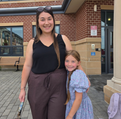 Sarah Estrella picks up her daughter at Wareham Elementary School after her first day. Photo by Tanvi Kulkarni