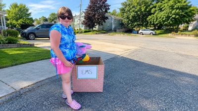 Ainslee Manduca with one of her donation boxes. Submitted photo