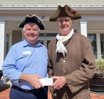Howard Smith of the Minutemen and Militia accepts a grant from Glen Sherman of Cape Cod 5 to support the recognition day event. Photo by Tanvi Kulkarni