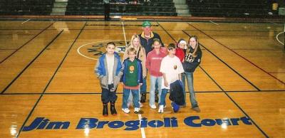 Brogioli with seven of his 17 grandchildren on the basketball court that was named in his honor.