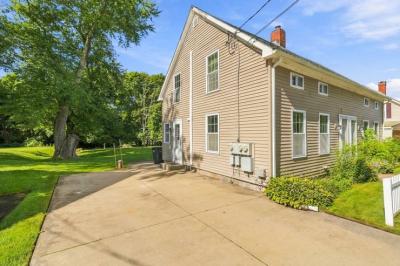 Side of 17 Beeden Road with the paved driveway and side entrance, Westport, MA