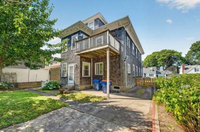 Rear of 370 Maple Street with a second-floor deck and back entry, New Bedford, MA