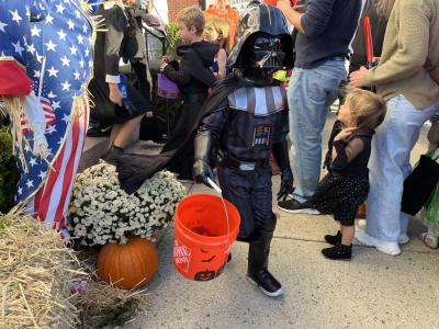 Darth Vader makes his way down the sidewalk. 