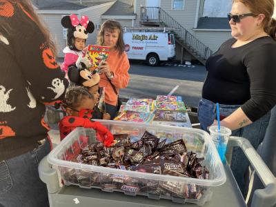 Kids pick out candy and coloring books. 