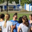 Coach speaking to players