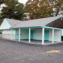The iconic turquoise building sits empty.