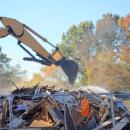 The demo took down the two-story home. Photo by Brandy Muz The demo took down the two-story home. Photo by Brandy Muz
