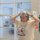 Cathy Longfield tries on part of a knight costume.
