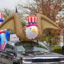 The bald eagle floats through the parade. 