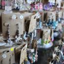 Handmade jewelry at one table. 