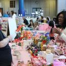 The Bunniary table laughs with customers. Photos by Brandy Muz