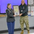 Ava poses with her award.