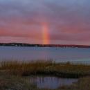 A rainbow drops in for the last few minutes of sunlight.