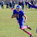 Amare Rose runs for the endzone, avoiding a tackle.