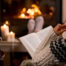 Picture of someone reading in their home. 