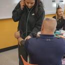 Alivia Benitez-Gaudette takes Pina's blood pressure.