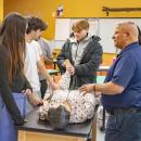 Students practiced real life situations with a dummy.