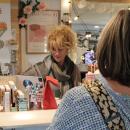 Shari Aussant serving a customer.