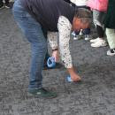 Patrick Marshall lays tape down for limbo. 