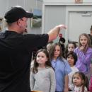 DJ Ooch directs the crowd during limbo.