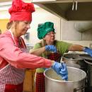 Pastor Ginny Doran stirring up some clam chowder.