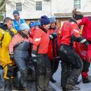 The team lifts the first dolphin inside the rescue truck.