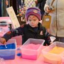 Getting crafty with the colors, Isaac Silva makes his ornament.