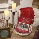 A display set up with a book with items from across the sea.