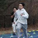 Practing alongside his teammates Owen Dillen runs. 