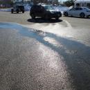 Water trickling onto Onset Avenue. 