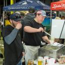 George Stuart, left, and Dan Degan serve of Luna Mezza’s signature chowder to attendees in 2025. File photo