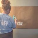 Hallahan creating one of her banners.