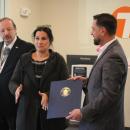 Nelson Tavares receives a citation of support from Senator Kelly Dooner's office. 