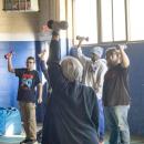 Marybeth Kiernan helping her students with proper form.