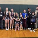 The team with their coaches. 