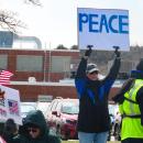 One protestor simply asks for peace. 