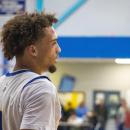 Amare Rose looks down court. 