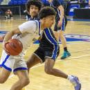 Aaron Cote evades a Royals player.