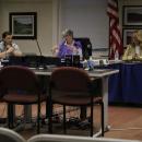 From left, Joey Still, Judith Whiteside and Sarah Corbitt discuss the Purple Heart Community designation. Photo by Brandy Muz