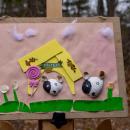 One piece of art shell-abrates a pair of dogs. 