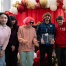 Adviser Joey Ferro holds the Rising Star Award with his students. Photo source: Plymouth Area Prevention