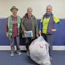 Hilary Greene, Jo-Ann Finn and Amanda Cobb with the collected bag of plastics. 