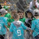 Two teeball teams showing good sportsmanship following their game.