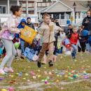 Kids hop to it to get the eggs.